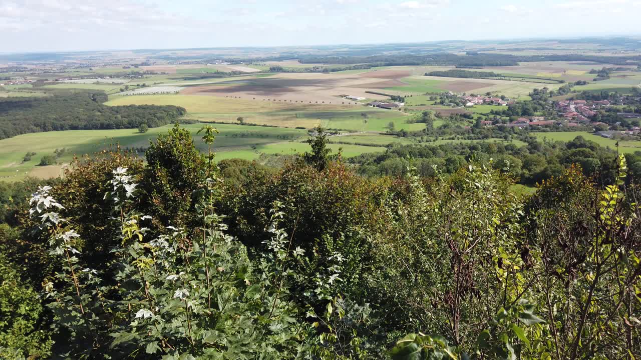 A panoramic view of Sion Hill showcasing lush green fields, scattered villages, and a serene landscape under a clear sky.