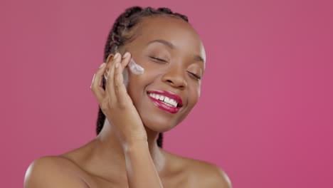 black woman, face or beauty cream on isolated pink