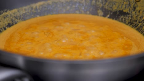 adding a pinch of salt to the soup, static close up