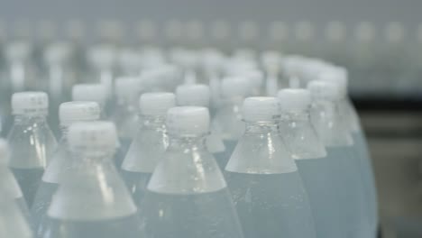 conveyor belt with bottles of drinking water at a modern beverage plant