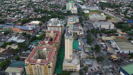 aerial tilt-up reveal of condominium apartment buildings in densely populated city of marikina city, philippines.