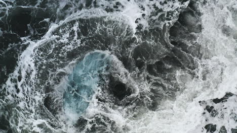 Stunning-drone-shot-of-surf-with-ice-rocks-at-Diamond-Beach-in-Iceland