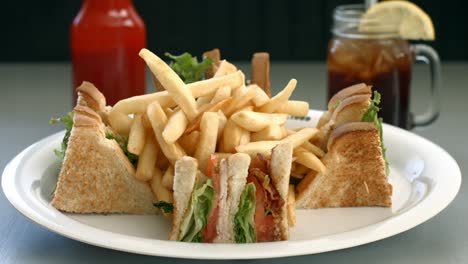 turkey club sandwich with french fries, and sweet tea