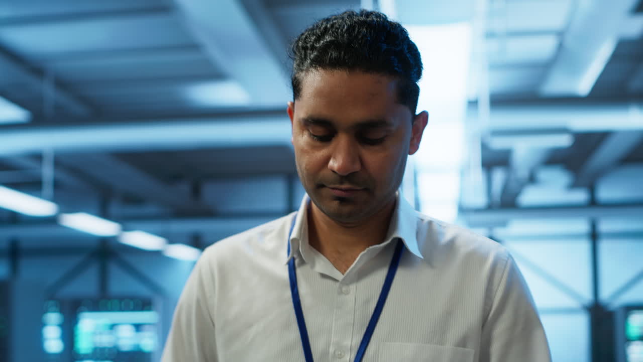 System administrator in data center managing and maintaining databases