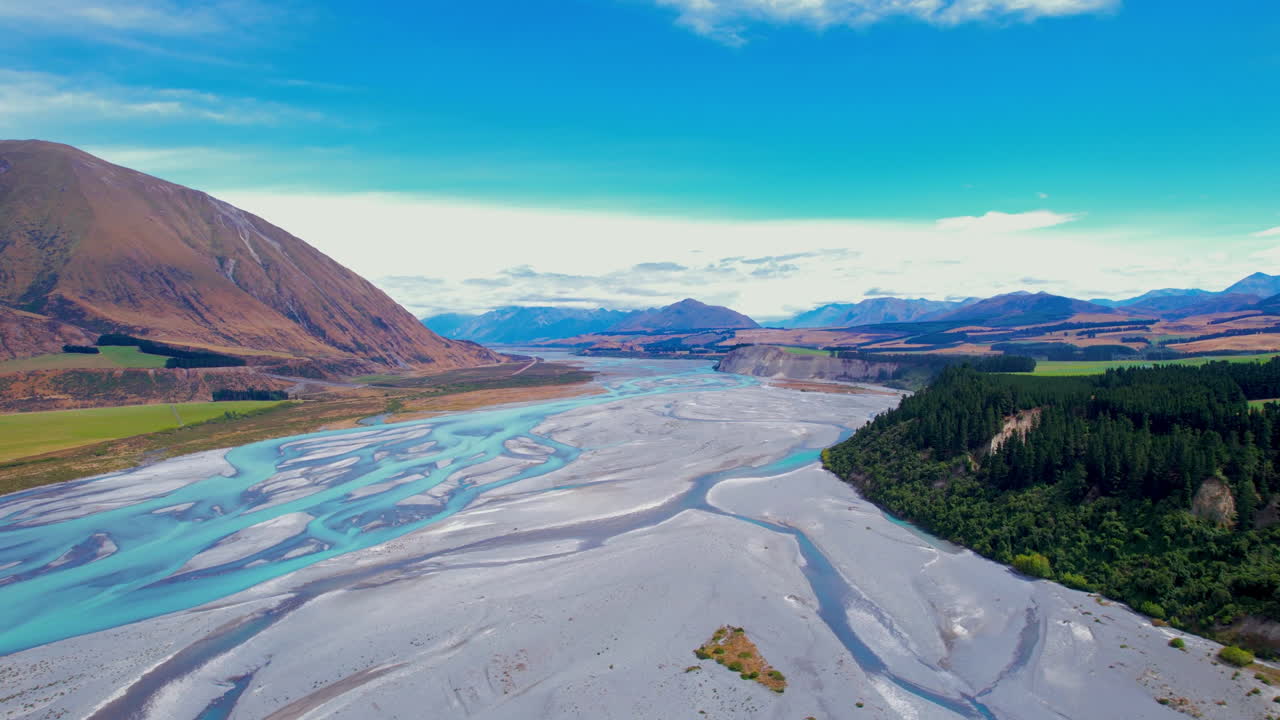 Aerial view flying over the river delta of the Rakaia George in sunny New Zealand