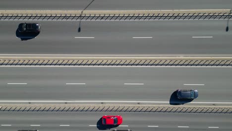 Aerial-Drone-Flight-top-down-View-of-freeway-busy-city-rush-hour-heavy-traffic-jam-highway