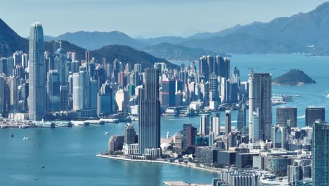 4k tele zoom view of hong kong central district - slow pan aerial view angle from sky.