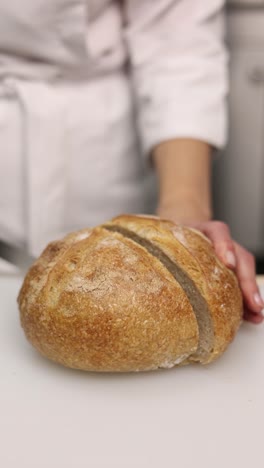 chef slicing freshly baked bread