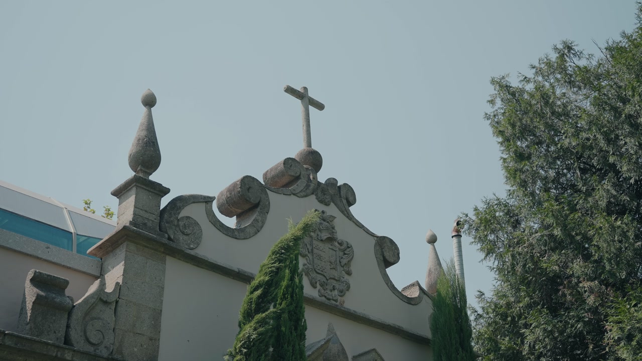 stone gable cross with crest and finials against clear sky