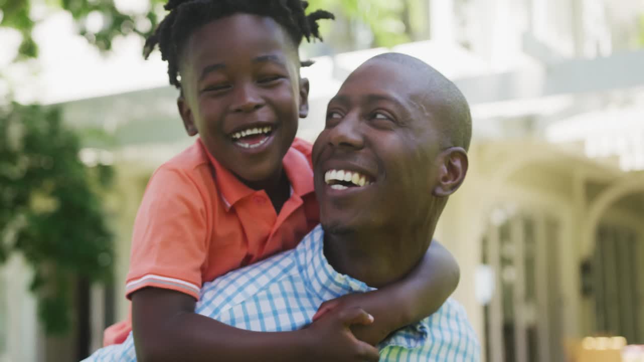 Portrait of an African American man and his son