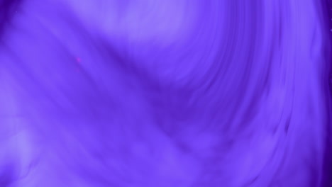 macro shot of abstract purple clouds swirling