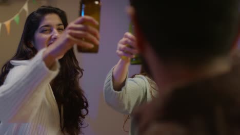 Group-Of-Friends-At-Home-Or-In-Bar-Celebrating-At-St-Patrick's-Day-Party-Drinking-Alcohol-And-Doing-Cheers-Together