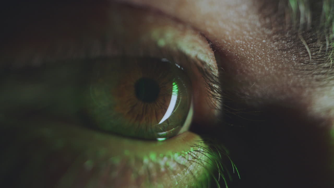 Close-up of a Human Eye with Green Light