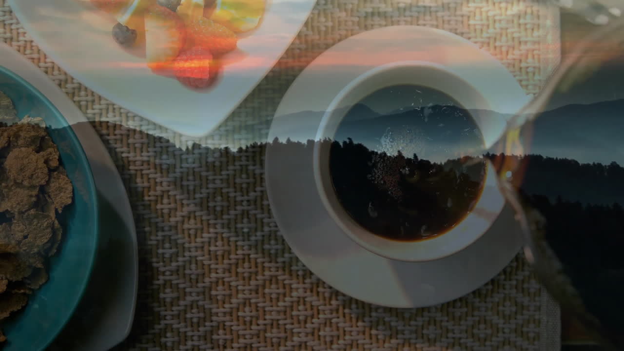 Double-exposed breakfast pouring coffee over placemat as cereal and fruit blending into peaks