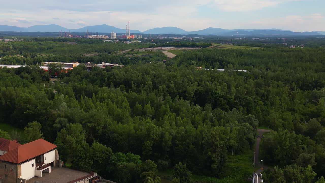 Industrial horizon over reclaimed post coal mining green landscape AERIAL
