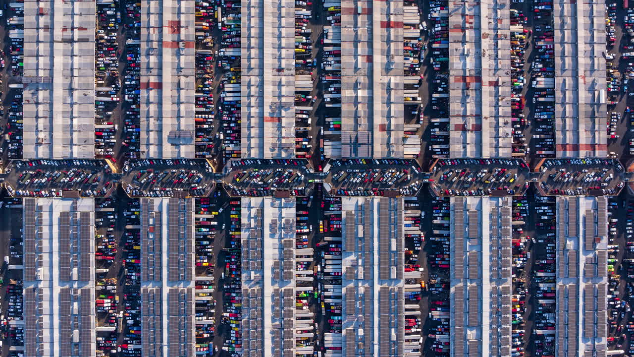 Vertical aerial view of Central de Abasto, Mexico’s largest wholesale market, revealing structured warehouse rows and vibrant commercial activity.