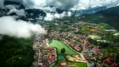wide aerial hyperlapse view over touristic sa pa in vietnam with mountain fog