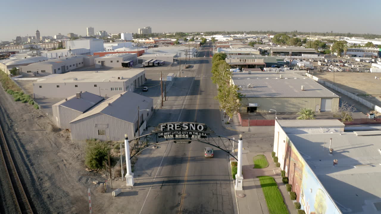 Aerial view of the Fresno archway sign on Van Ness Avenue with railroad tracks