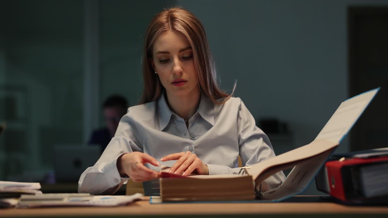 Woman working with documents in office