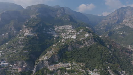 aerial footage flying around the mountains and hills of the amalfi coast italy during the day