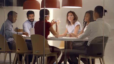 corporate business team in discussion in a meeting cubicle