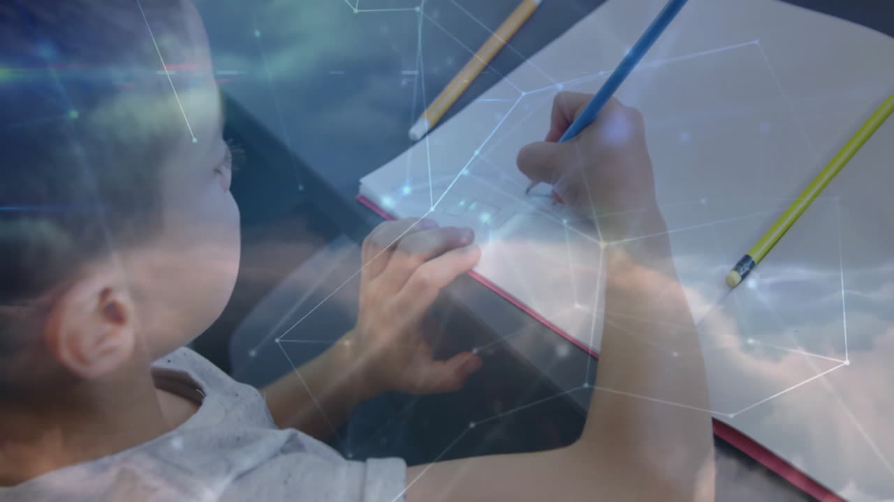 Student boy writing in notebook at desk, overlaying technology network and cloud computing icons