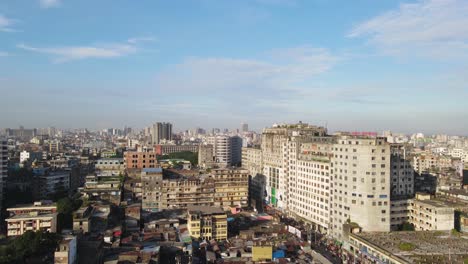 aerial view shot of dhaka packed buildings with camera moving up in the air