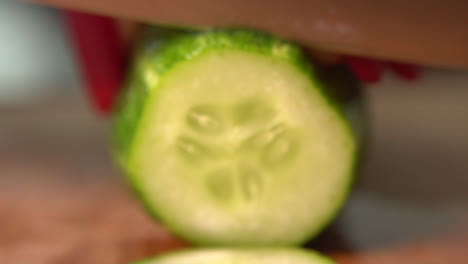 knife cuts vegetables for salad in slow motion