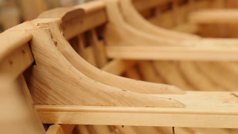 completed oak knees installed in wooden boat frame, close up detail view