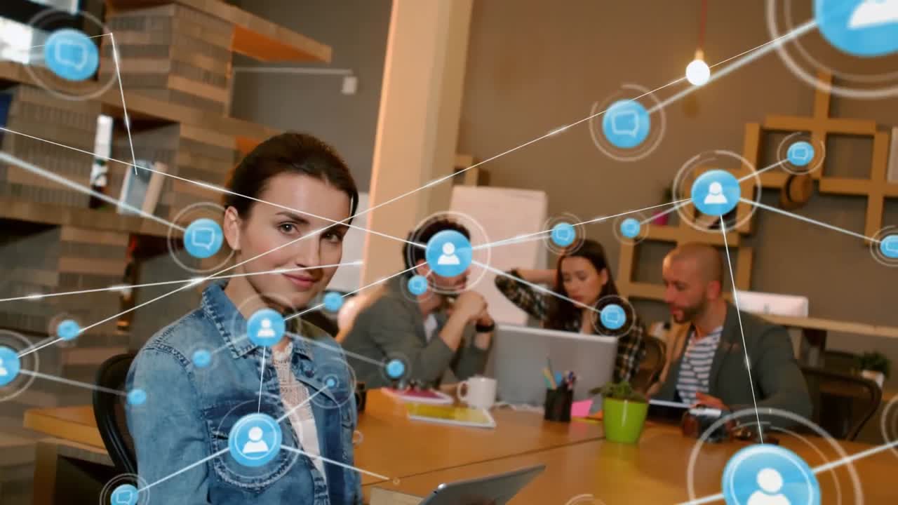 animación de una red de iconos digitales sobre el retrato de una mujer caucásica feliz usando una tableta en la oficina