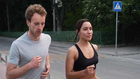 Happy-Couple-Running-Together-In-The-City