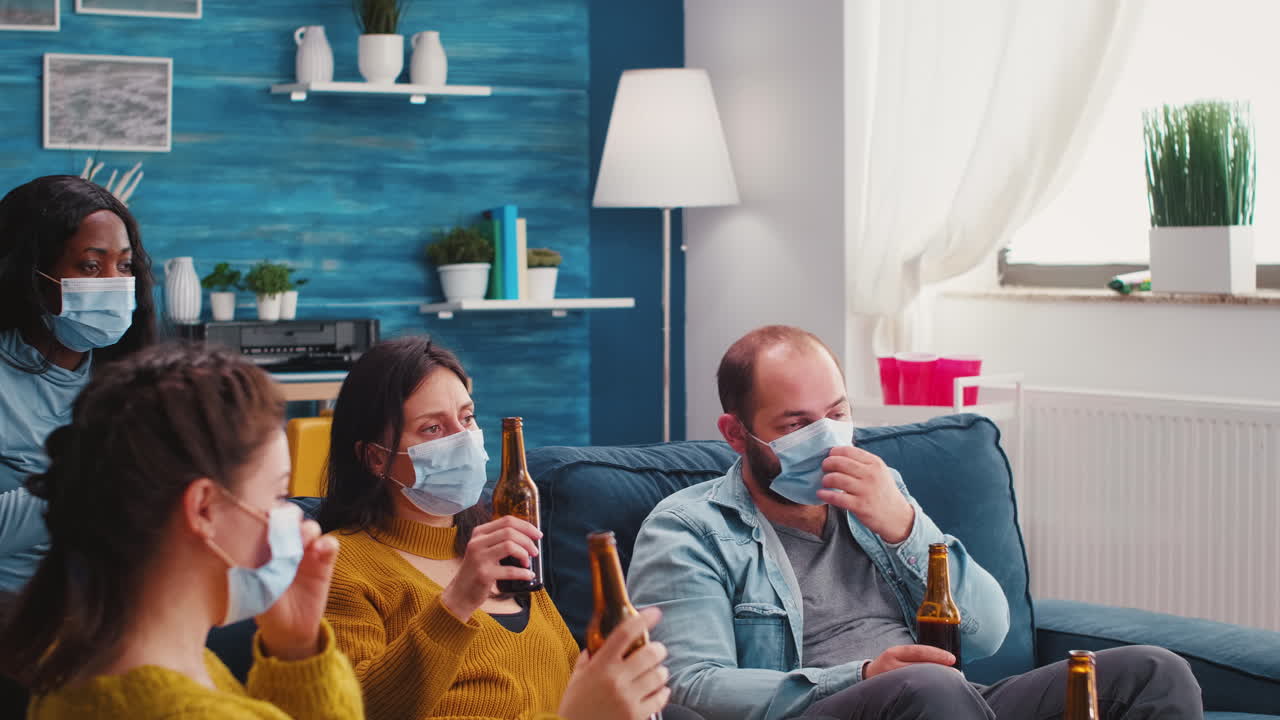 People toasting and cheering bottles of beer spending free time