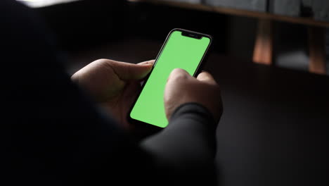 Close-up-and-slide-movement-of-a-man-using-a-smartphone