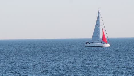 a sailboat glides across the ocean