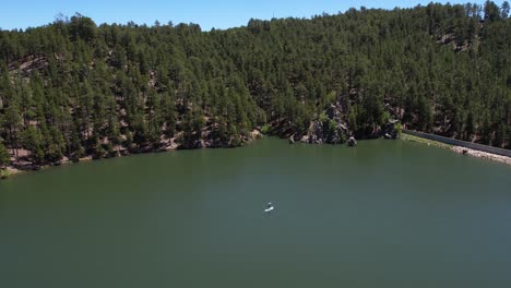 Paddleboarding-in-Center-Lake,-Custer-State-Park,-South-Dakota