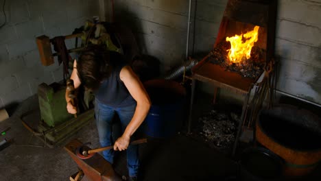 female metalsmith molding horseshoe 4k