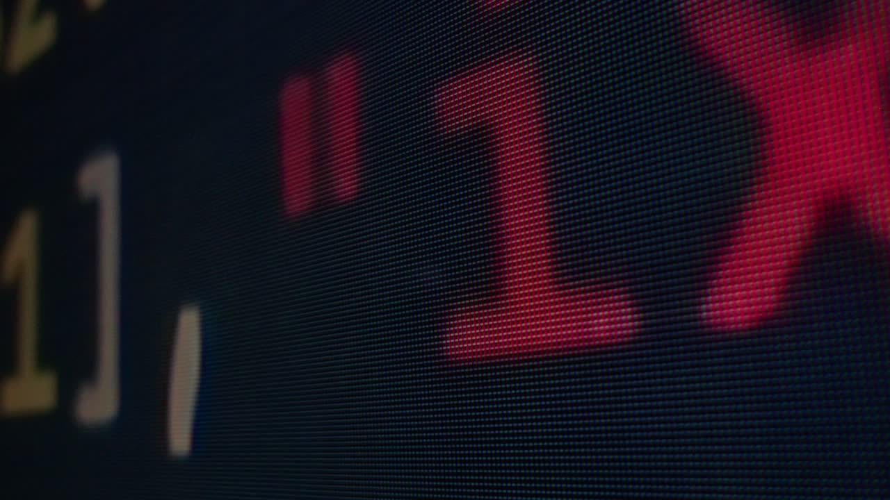 Close-up of a digital display showing numbers and letters