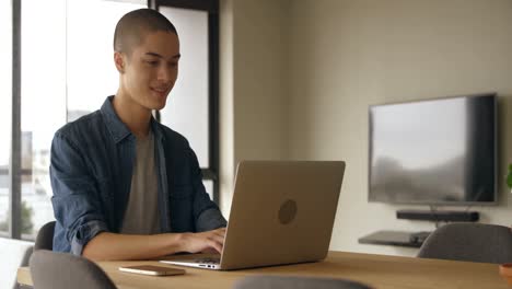 Man-using-mobile-phone-and-laptop-at-home-4k