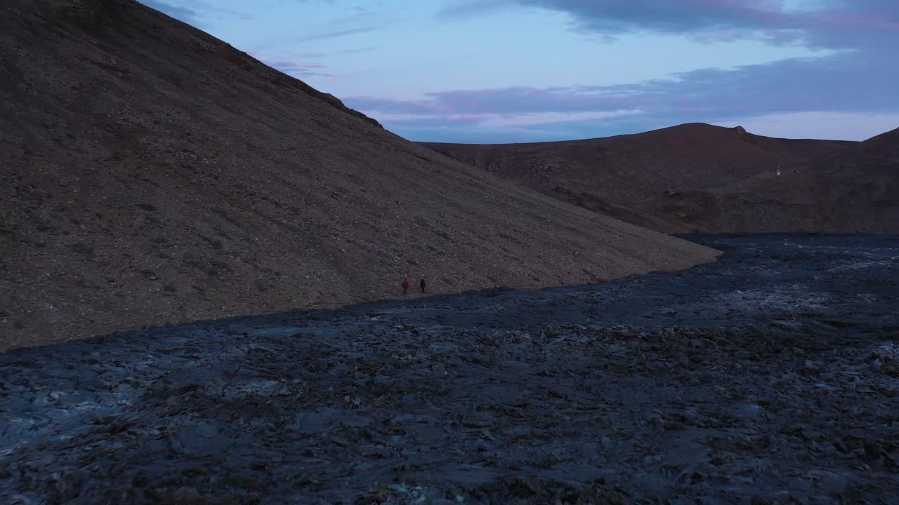Hiking Through a Volcanic Landscape at Dusk