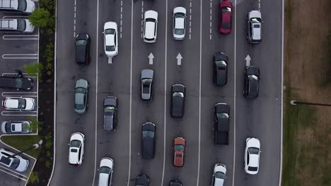 Aerial-top-down-shot-of-cars-and-vehicles-in-lanes-of-gas-station-pumping-petrol-during-shortage