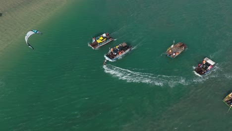 Kitesurfer-threads-between-cruising-boats-and-closely-pass-them