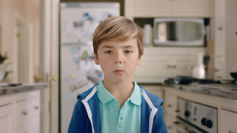 portrait-happy-little-boy-smiling-at-camera-cute-child-at-home-in-kitchen