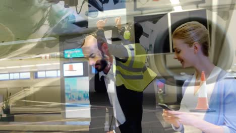 Airport-worker-near-airplane-against-businessman-picking-up-suitcase-from-conveyor-belt