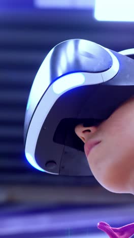 young individual wearing virtual reality headset, immersed in digital experience, showcasing advanced technology and modern gaming environment with vibrant lighting