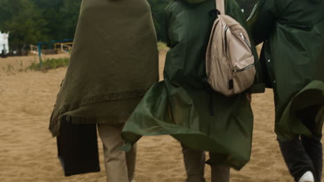 Friends-walking-on-the-sand