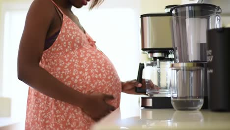 pregnant woman in kitchen