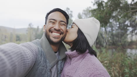 couple, hiking in nature and selfie of kiss