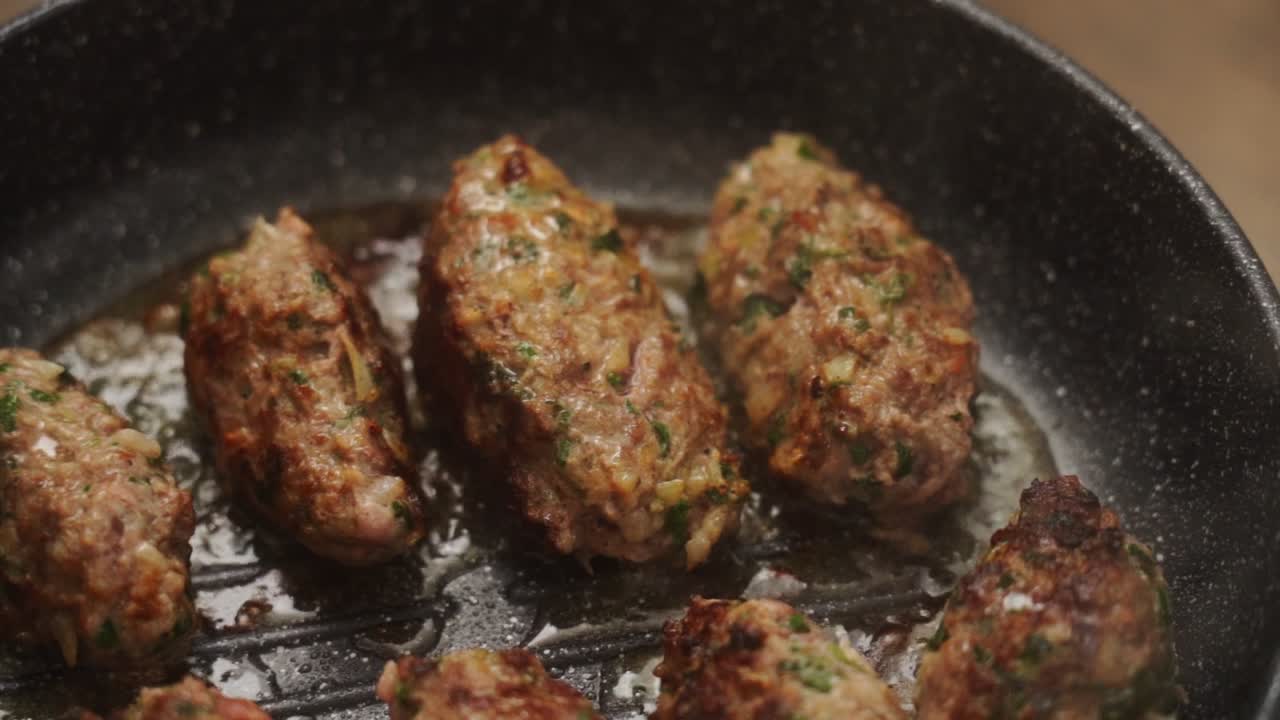 Salisbury steaks frying on pan