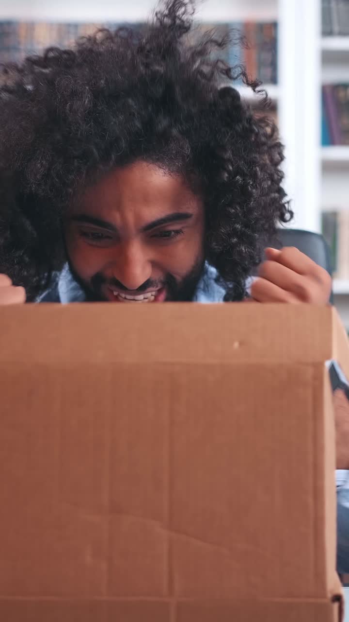 Unboxing a mystery package at home while sitting in a cozy reading nook