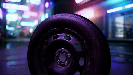 a spare tire on a wet street at night